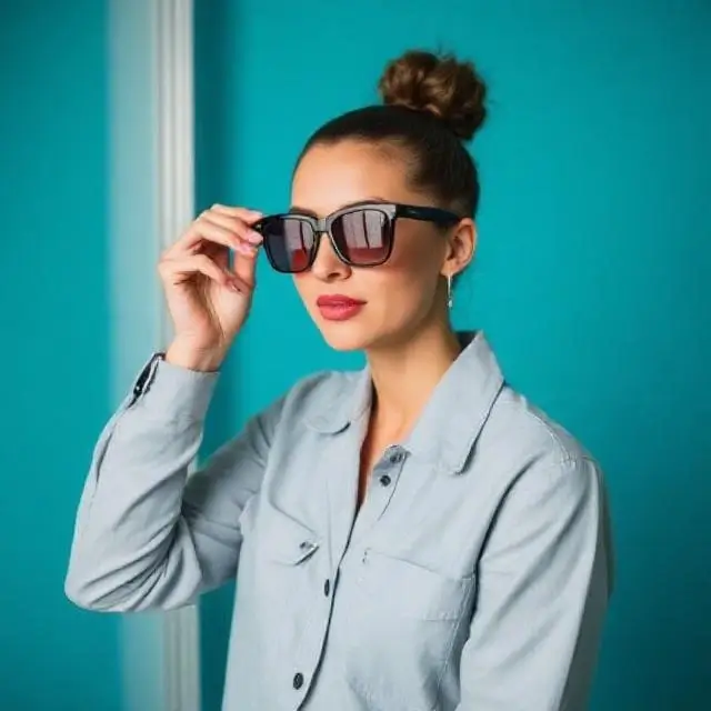 A model in a candid, natural moment between shots.